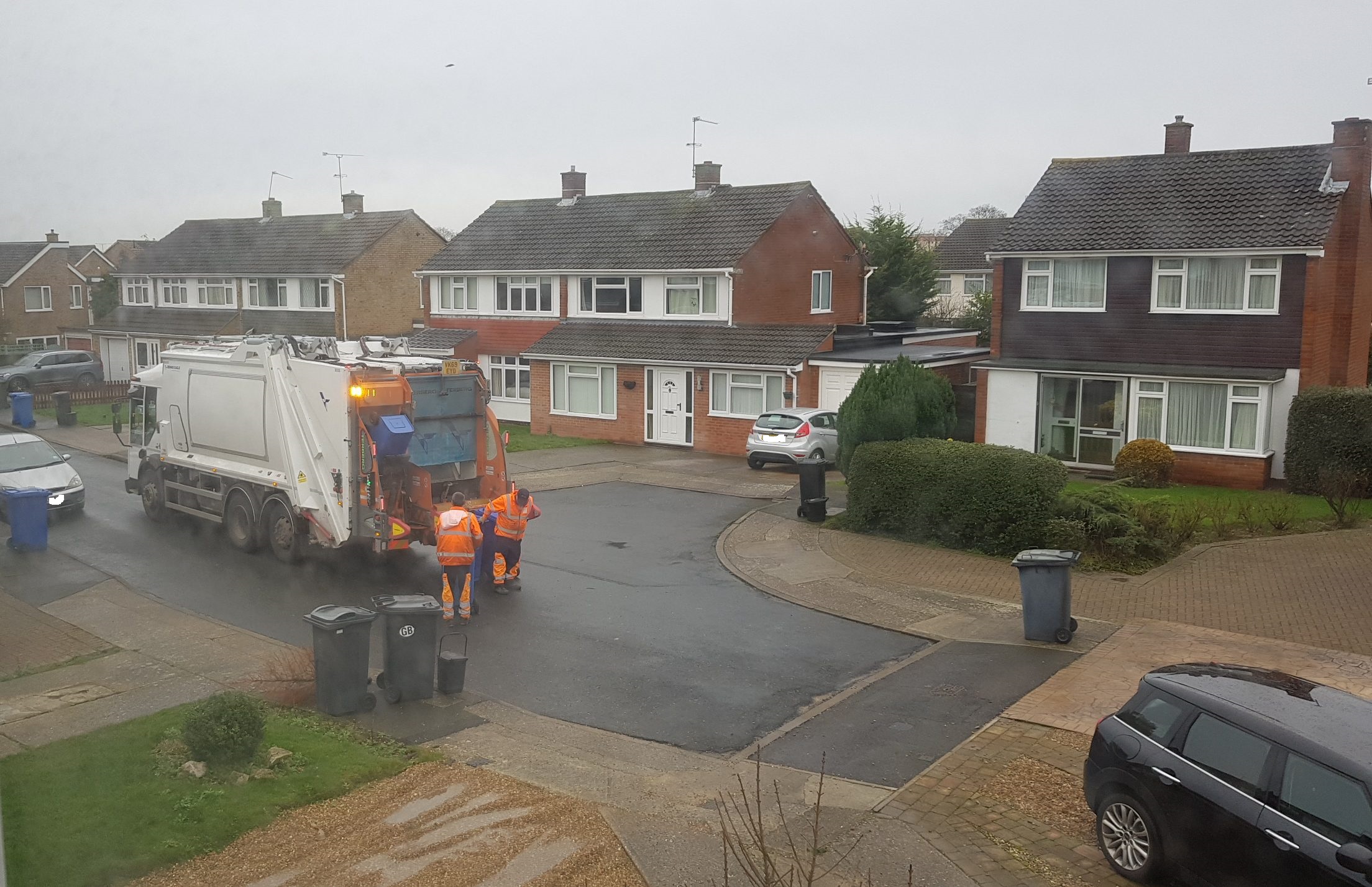 bin lorry collecting waste no plates